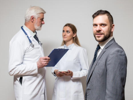 Confident doctor shaking patient's hand