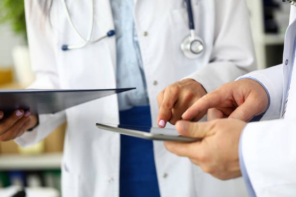 Confident doctor shaking patient's hand